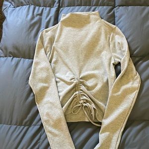 Cropped, cinched long sleeve shirt